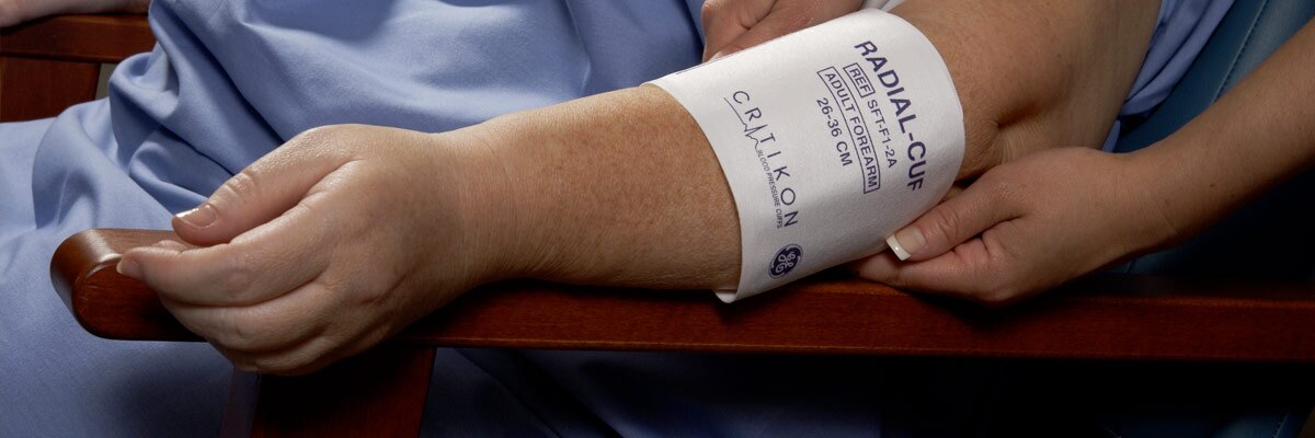 blood pressure cuff on arm - Wyoming Department of Health